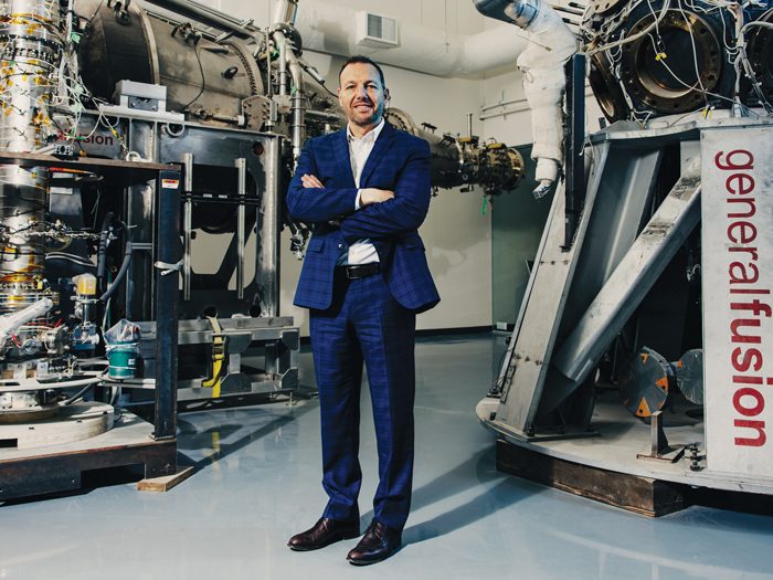 Greg Twinney standing in front of machines at General Fusion 